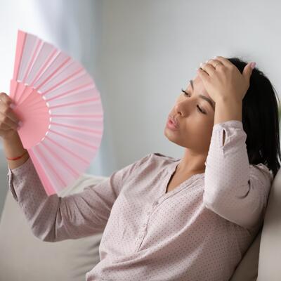 A woman fans herself