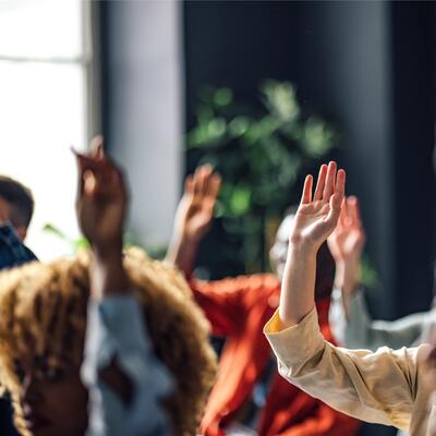 A group of people raising their hands