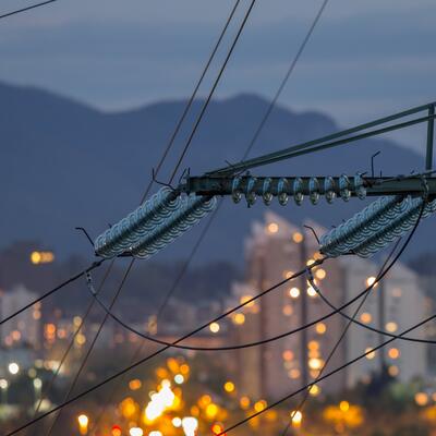 A close up photo of wires on a transmission line