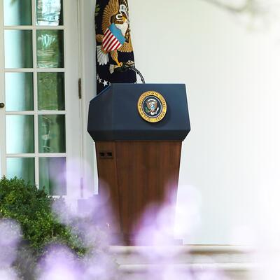 A presidential lecturn in the Rose Garden